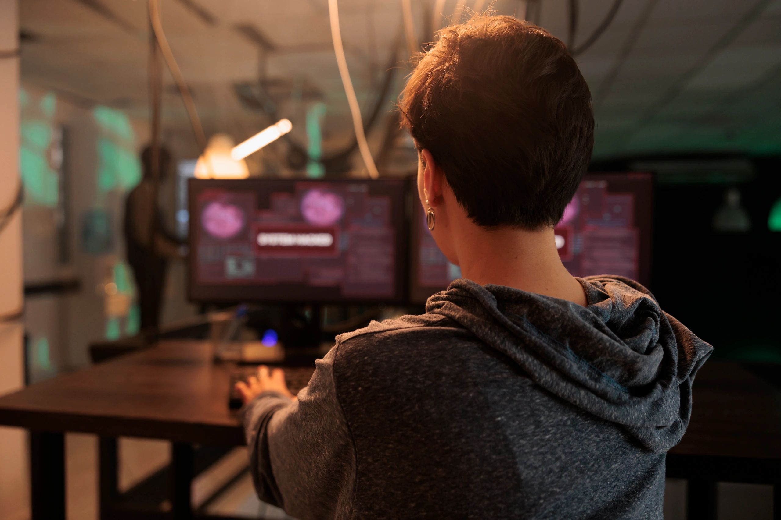 Dark workstation with multiple monitors used for analysis